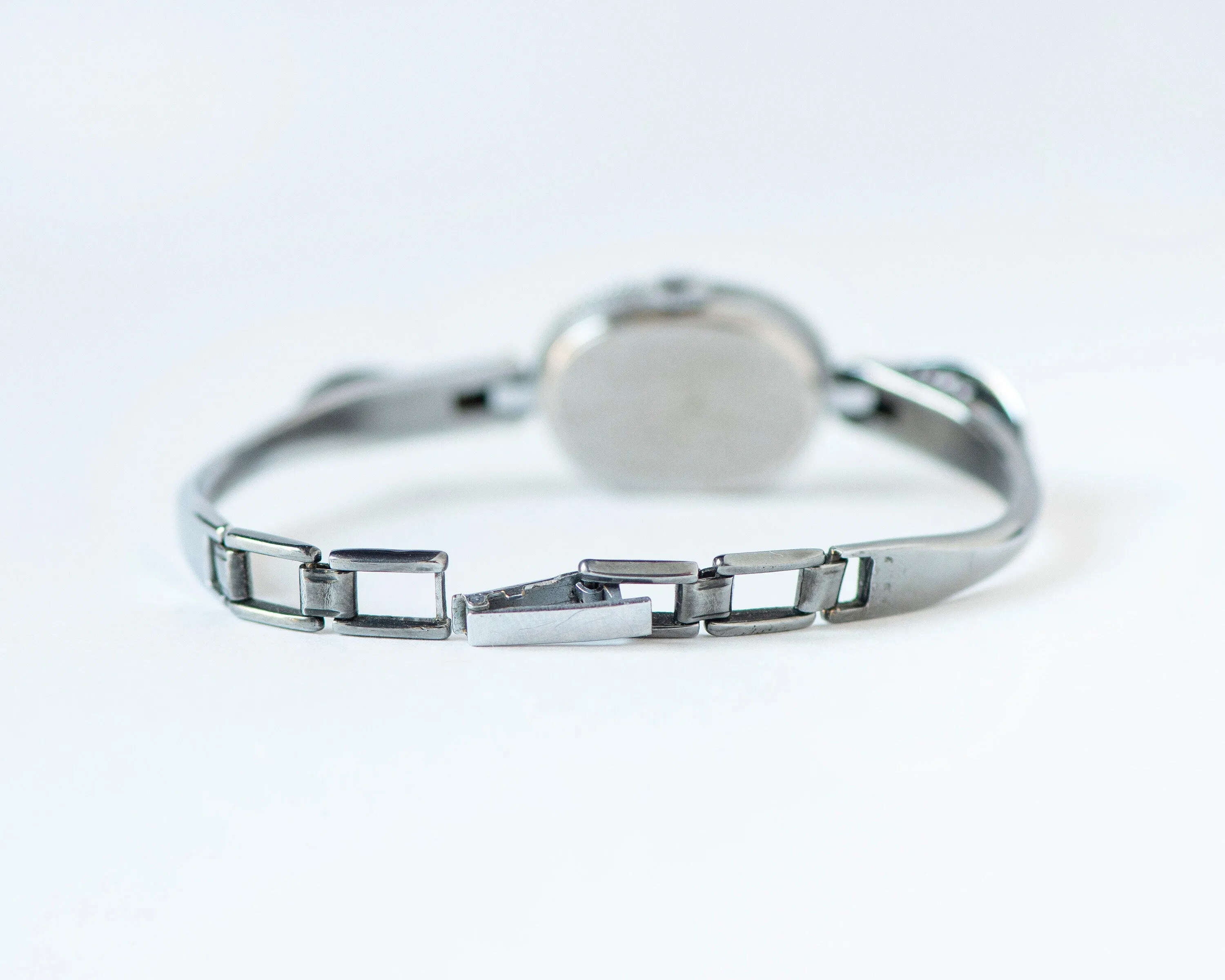 Mint condition women cocktail watch oval blue dial leaf trim on bangle, vintage watch for women Ray silver shade, classic jewelry bracelet